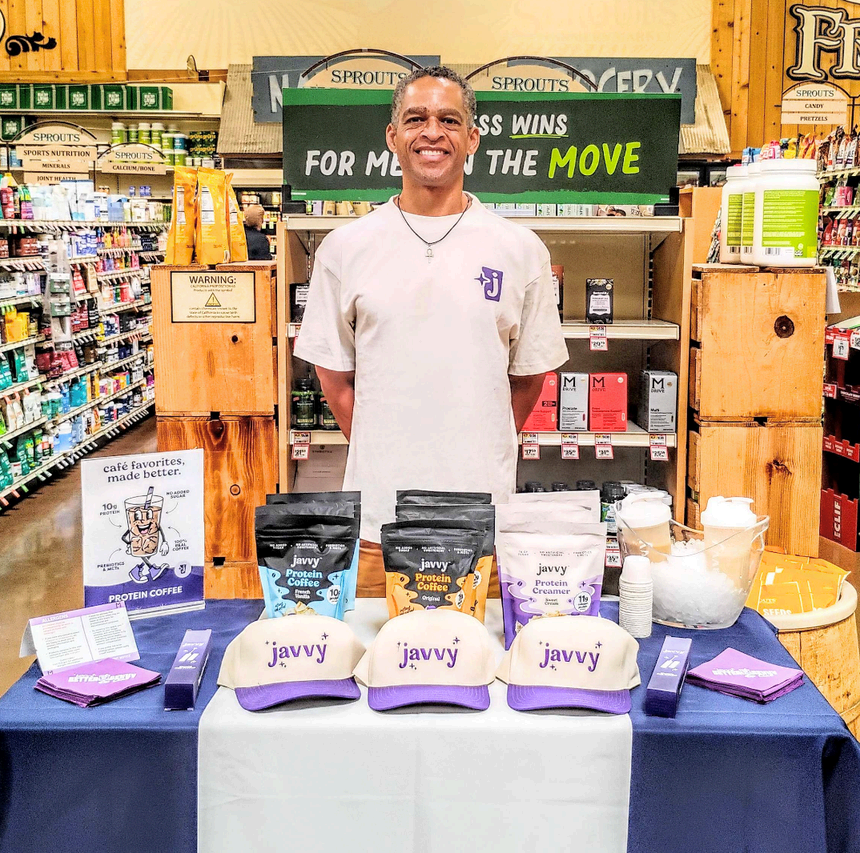 Brand ambassador sampling Javvy protein coffee at Sprouts Farmers Market