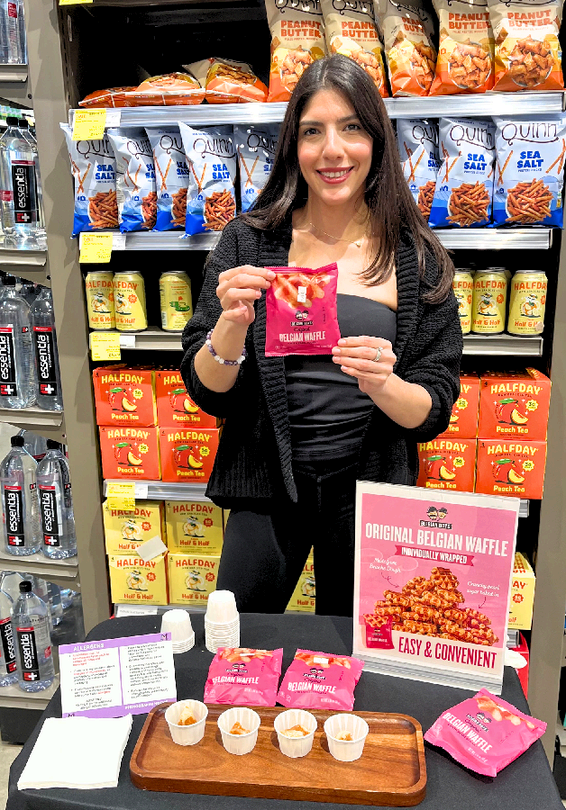 Brand ambassador sampling Belgian Boys waffles in a grocery store